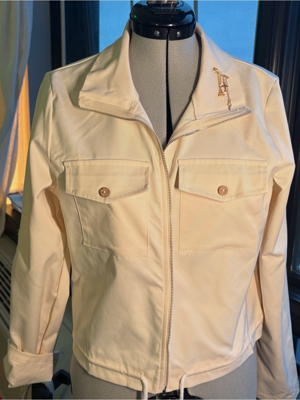 Women’s Lightweight Zip-Front Jacket in Cream with gold charm